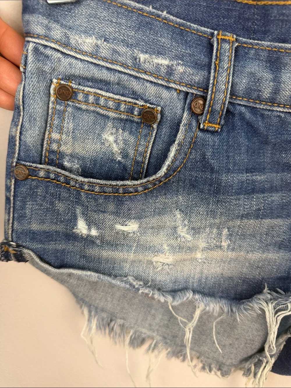 One Teaspoon NO 2’s Low Rise Jean Shorts 8” Rise Raw Curved Hem Sz 25 Distressed